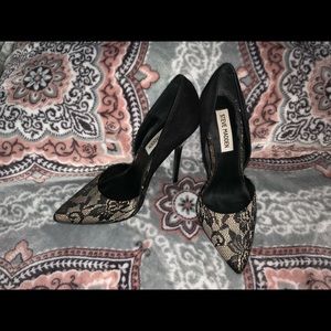 Black lace pointed toe heels.